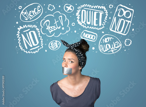 Young woman with glued mouth and thought clouds