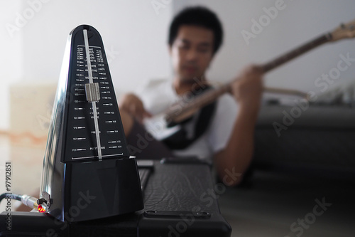 Black metronome is used by musician to help keep a steady tempo as he play, or to work on issues of irregular timing, or to help internalize a clear sense of timing and tempo.