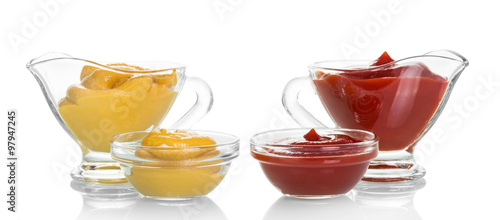 Ketchup and mustard in glass isolated