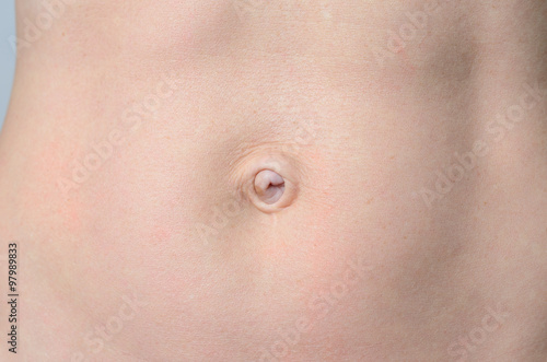 Flat Belly of a Bare middle-aged Woman in Close up