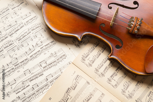 Vintage violin on the sheet music.