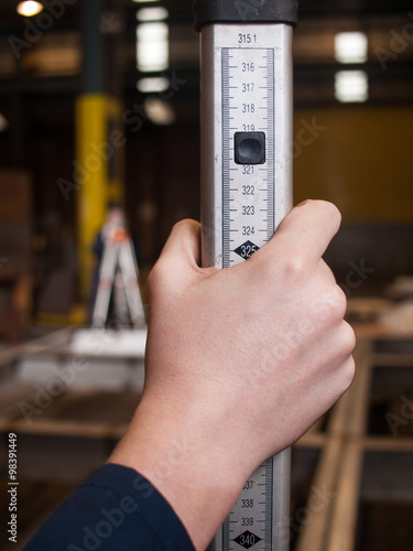 Measuring tool in a workers hand