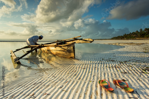 Traditional fisher boat in Zanzibar with people going to fish on