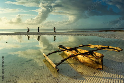Traditional fisher boat in Zanzibar with people going to fish on