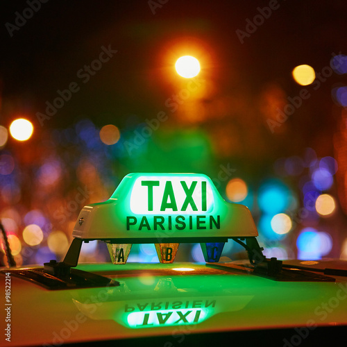 Green taxi sign in Paris, France