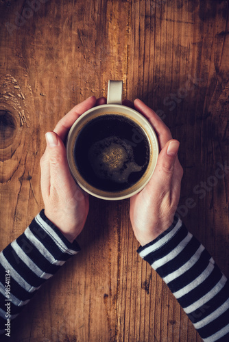 Lonely woman drinking coffee in the morning