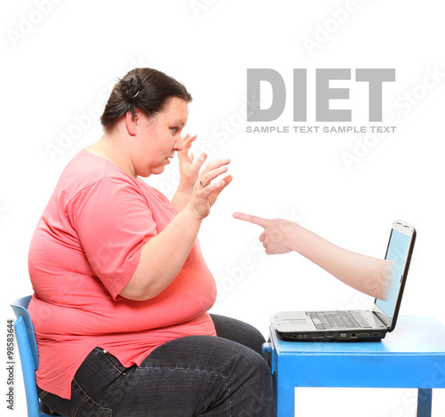 Overweight woman finding new diet online on her laptop. Picture with space for your text.