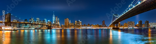 Night panorama with the downtown New York City skyline and the "Two Bridges": Brooklyn Bridge and Manhattan Bridge, viewed from Brooklyn Bridge Park