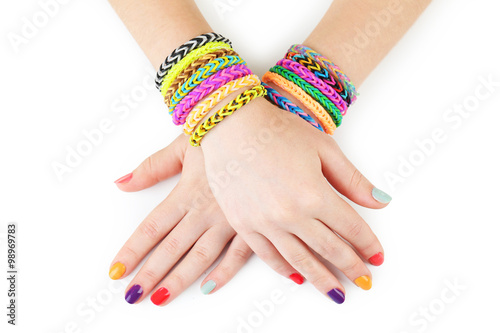 Loom bracelets on hands of young girl