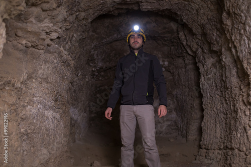 speleologist inside cave