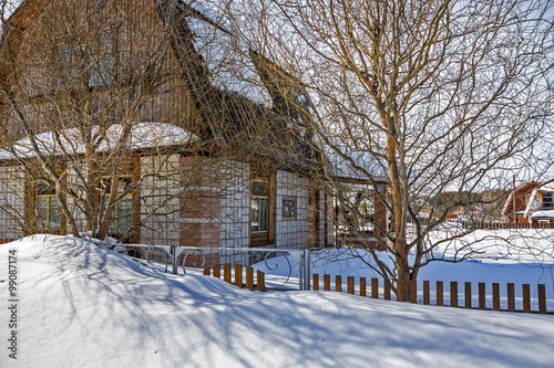 Cottage covered with snow