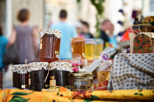 Local homemade honey and jam pots on a provencal market, organic food, Provence, South of France