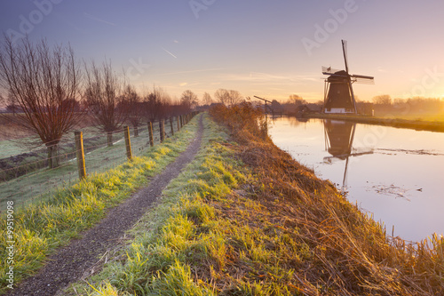Traditional Dutch windmill in The Netherlands at sunrise