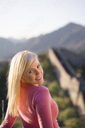Young woman visiting the Great Wall of China