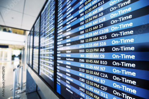 info of flight on billboard in airport