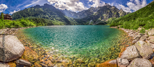 Panorama of lake in the middle of the Tatra mountains at dawn