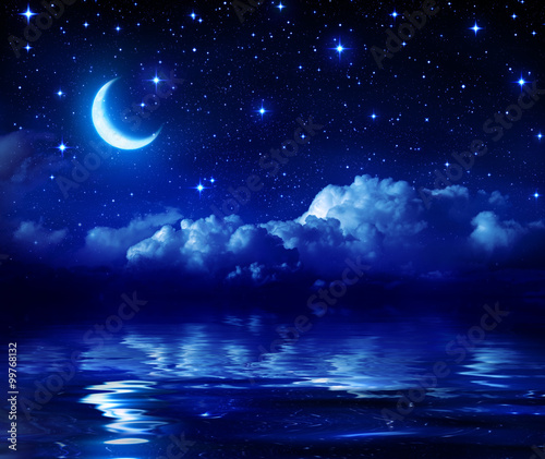 Starry Night With Crescent Moon On Sea 