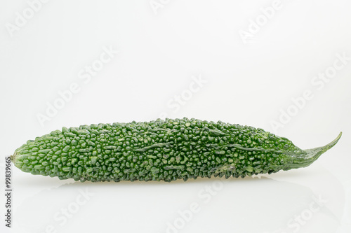 Green bitter gourd on white background