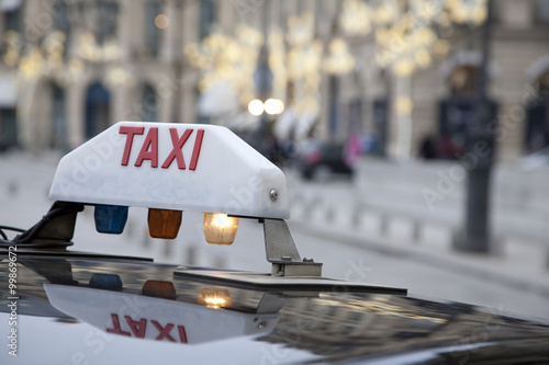 Parisian Taxi with Christmas Decoration in Background