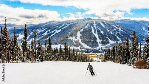 Skiing down to the village of Sun Peaks in the Shuswap Highlands of central British Columbia, Canada