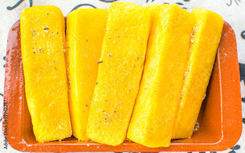 cornmeal mush or "polenta" slices yellow