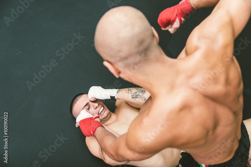 mma fighters fighting on the ground