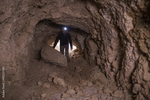 speleologist inside cave