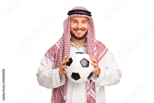 Young Arab holding a football