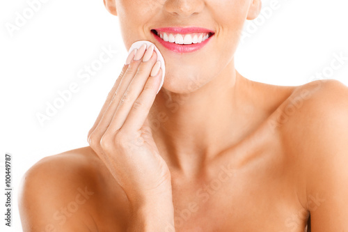 Portrait of a sensual woman removing makeup