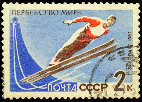 Flying skier on post stamp