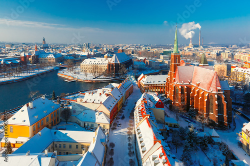 Aerial view of Old Town and Ostrow Tumski with church of the Holy Cross and St. Bartholomew from Cathedral of St. John in the winter morning in Wroclaw, Poland
