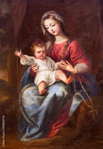 GRANADA, SPAIN - MAY 31, 2015: The Madonna (The Virgin of the Rosary) painting in church Monasterio de la Cartuja by unknown artist of 18. cent.