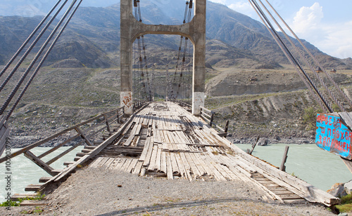 Old bridge over the river Katun, Altai, Russia.