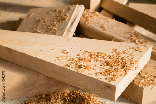 Wooden sticks lie on a workbench in the carpentry workshop