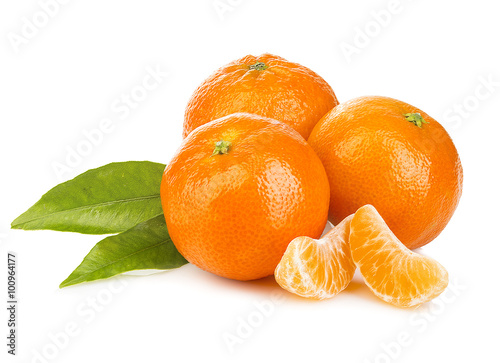 Ripe mandarines with leaves close-up on a white background. Tangerines with leaves on a white background.