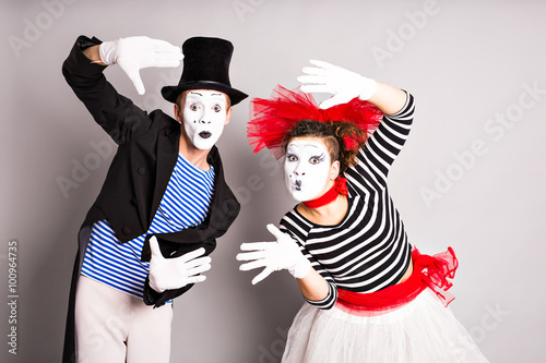 Waist-up portrait of funny mime couple with white faces. April Fools' Day - concept