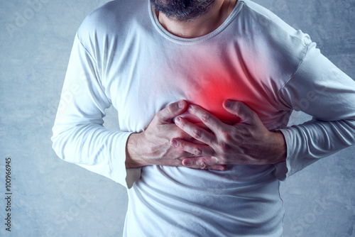 Severe heartache, man suffering from chest pain, having painful