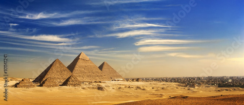 Egypt. Cairo - Giza. General view of pyramids and cityscape from the Giza Plateau (on front side: 3 pyramids popularly known as Queens' Pyramids; next: the Pyramid of Mykerinos, Chephren and Cheops)