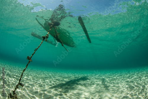 Wooden Outrigger Underwater in Remote Pacific