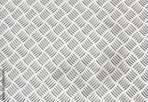 Diamond plate, also known as checker plate, tread plate, cross hatch kick plate and Durbar floor plate, wide shot in landscape orientation.
