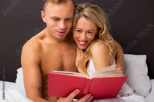 Couple reading a book together 