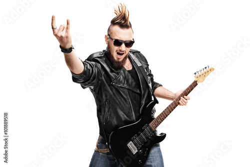 Punk rock guitarist making rock gesture