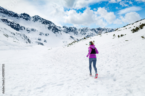 Winter running woman. Trail runner inspiration, sport and fitnes