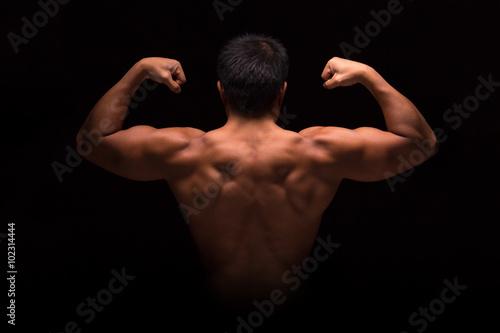 Muscular male upper body from the backside