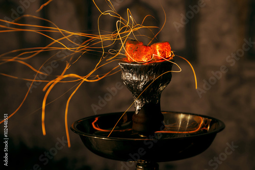 shisha hookah red hot coals. Sparks from breathe