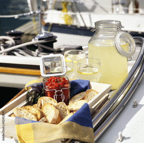 Bruschetta and lemonade on sailboat.