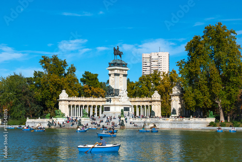 Park of Madrid, Spain on a blue-sky sunny day. Citizens of Madrid and tourists alike enjoy a fabulous warm November day in one of the main parks.