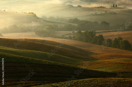 Idyllic view of hilly farmland in Tuscany in beautiful morning light, Italy