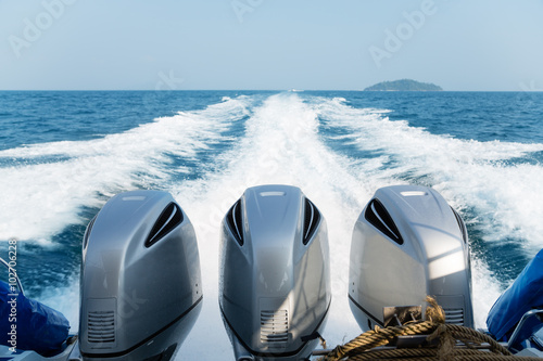 Three powerful engines mounted on the speedboat