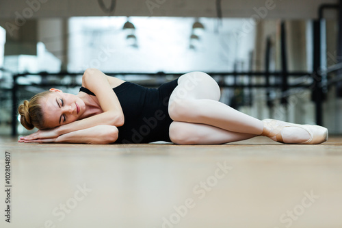Ballerina sleeping on the floor